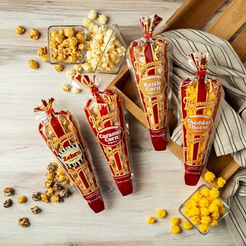 Assorted gourmet popcorn flavors in bags with loose popcorn.