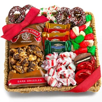 Holiday gift basket with chocolates, caramel corn, candies, and pretzels.